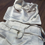 two-piece satin set with a halter top and wide-leg trousers