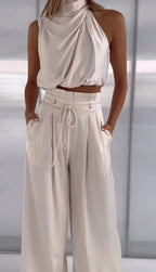 two-piece satin set with a halter top and wide-leg trousers